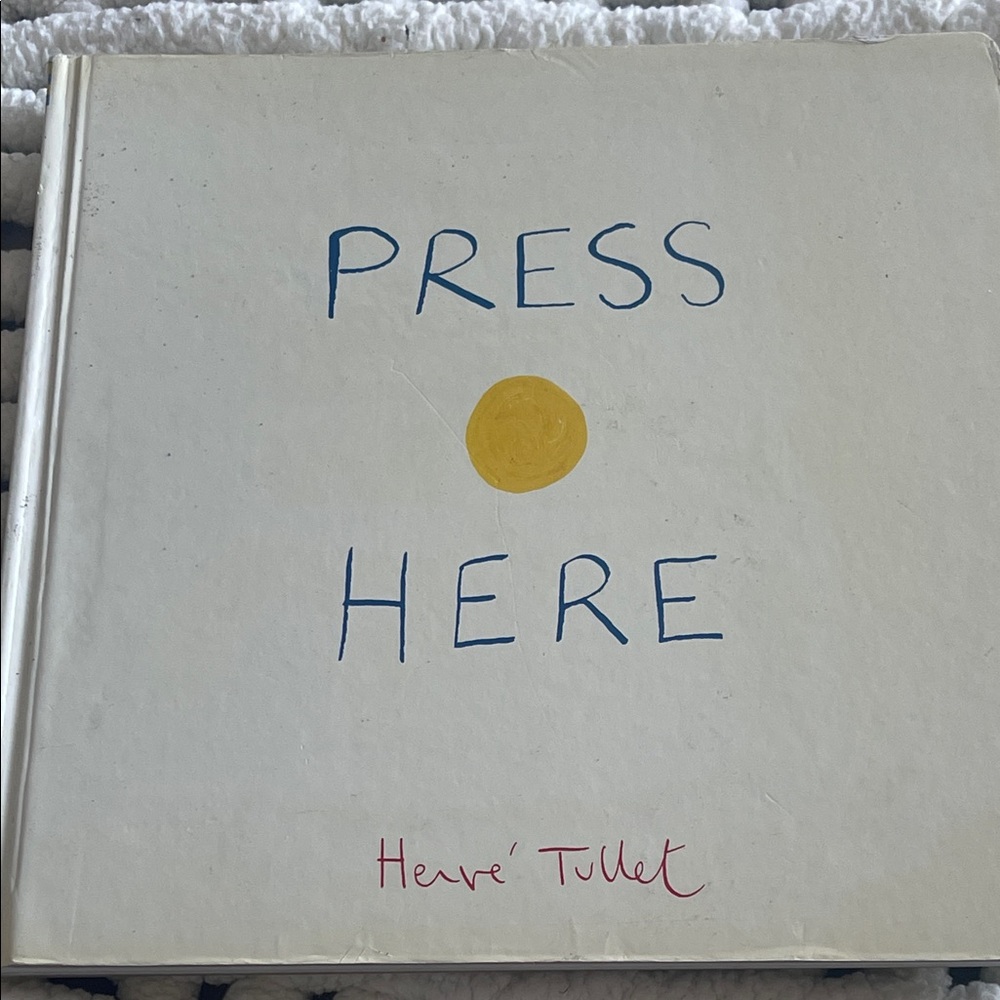 Press Here by Hervé Tullet Book, hard cover. Interactive,power of imagination.